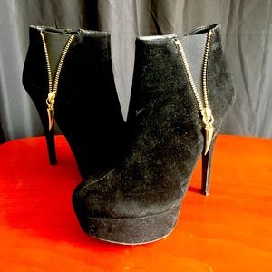 Booties with gold fashion zipper.